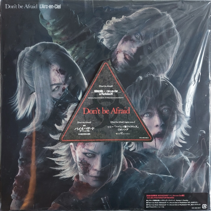 Front in plastic sleeve with stickers, zombie angle