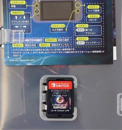 Inside of case with cartridge, manual, and presumed DLC sheet